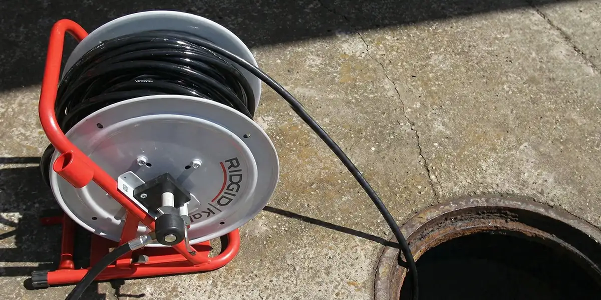 sewer rodding equipment prepared to clear clogged sewer lines in Charleston, SC